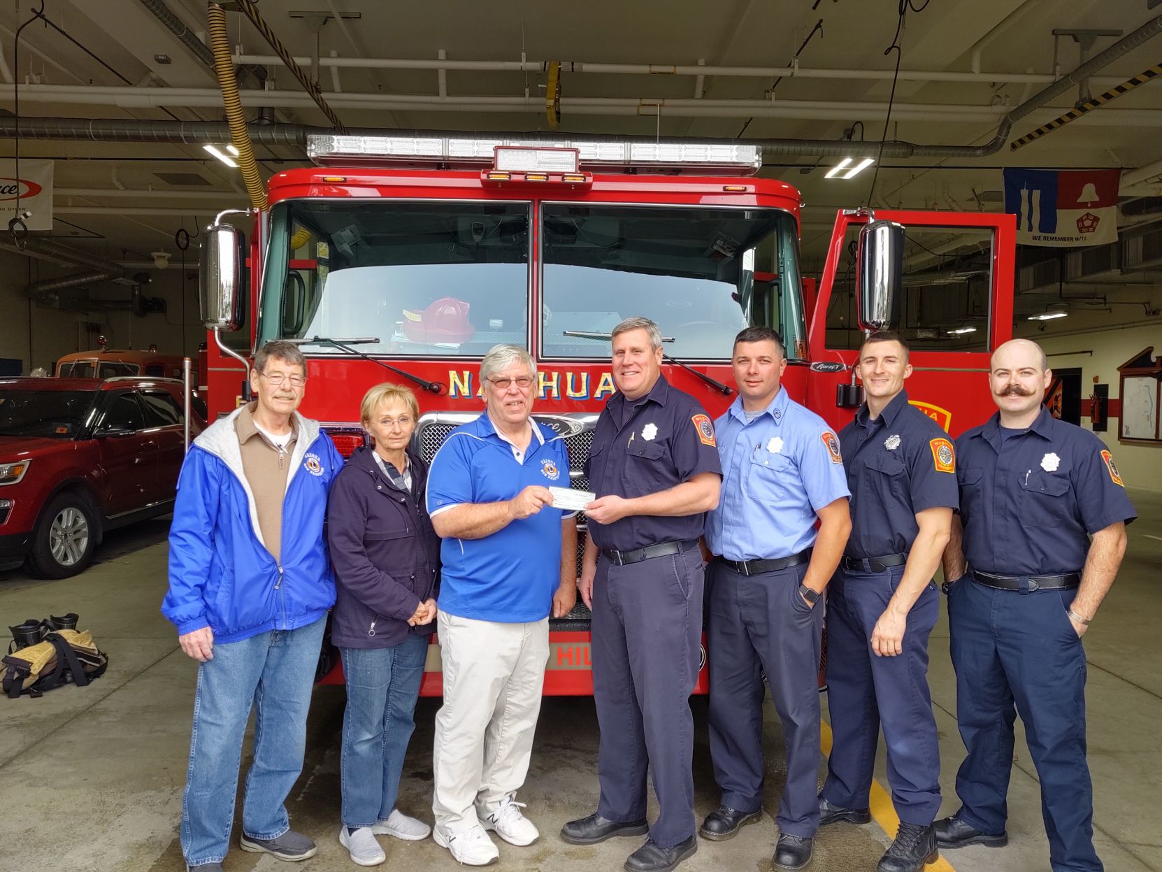 Scene Setter -- Lions Club donates to firefighters' coat drive